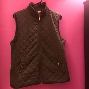 Army green vest with gold zipper and buttons.